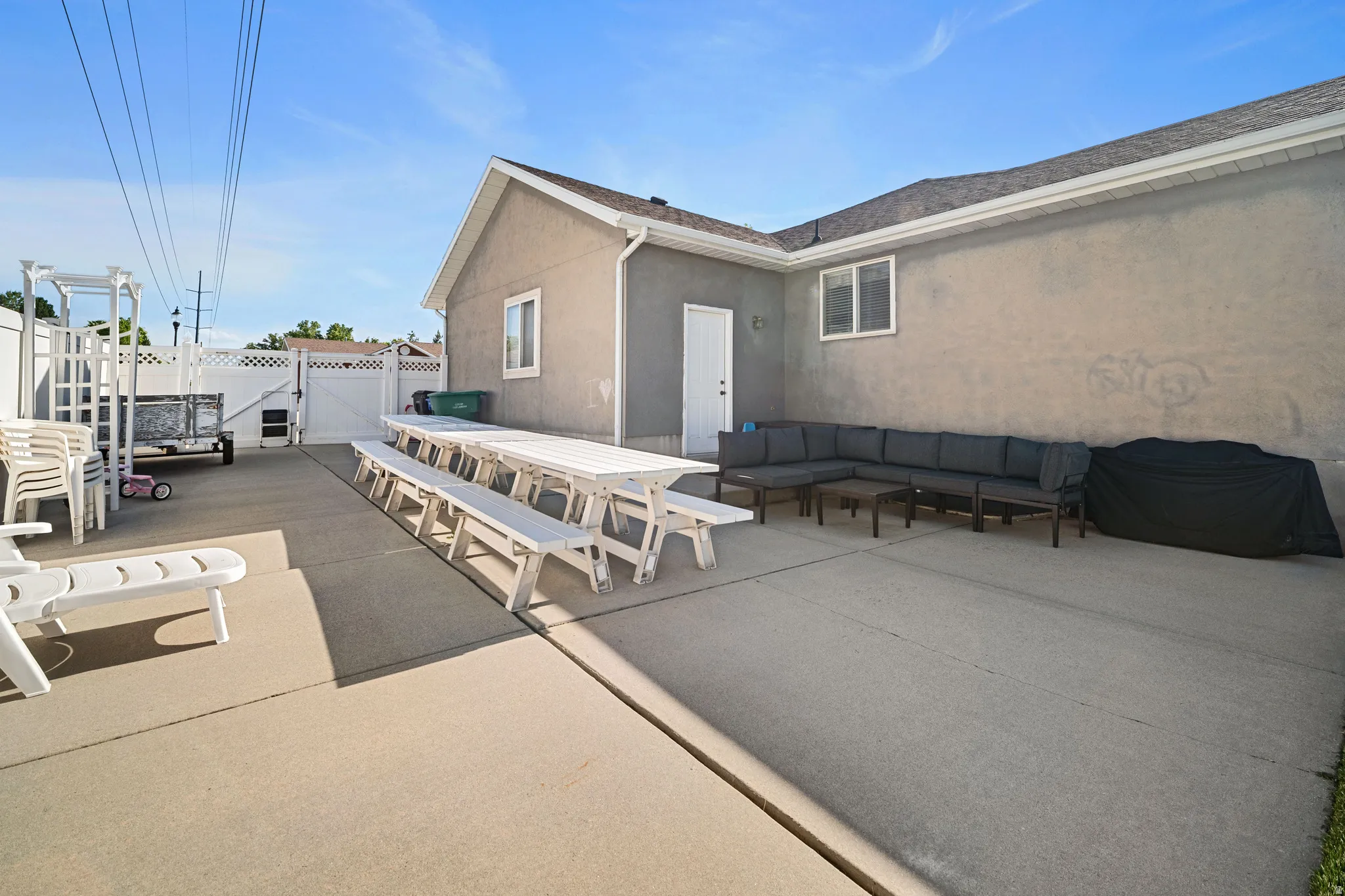 Expansive concrete on east side of home ideal for RV parking or gatherings.