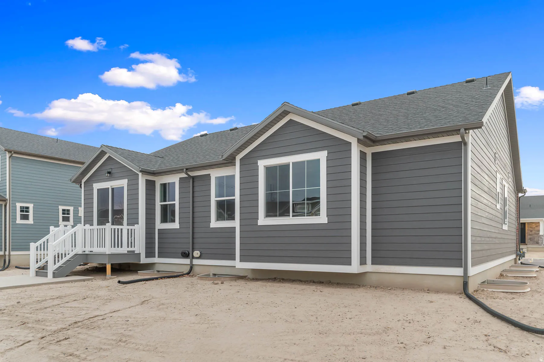 Contemporary gray siding exterior with white trim