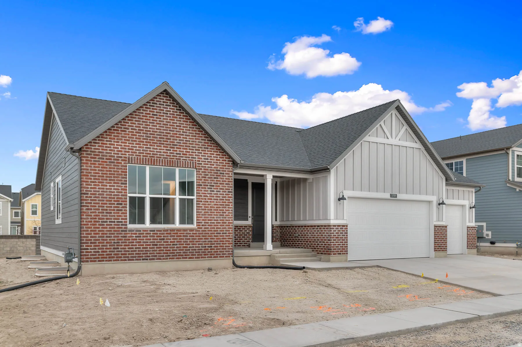 Contemporary exterior featuring a combination of brick and siding