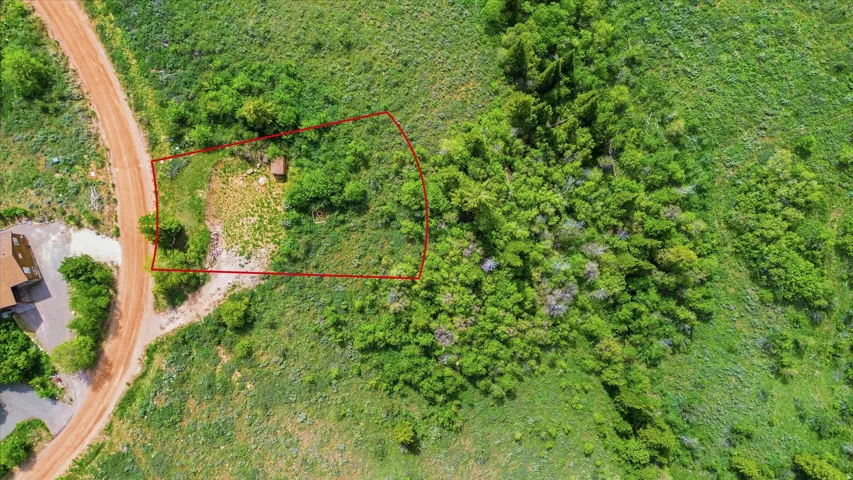 Expansive land parcel featuring natural topography and varied vegetation