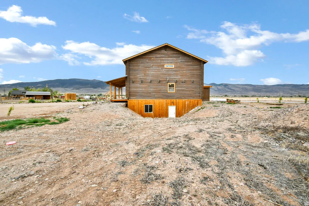 Two-story structure featuring wood plank siding and a pitched roof