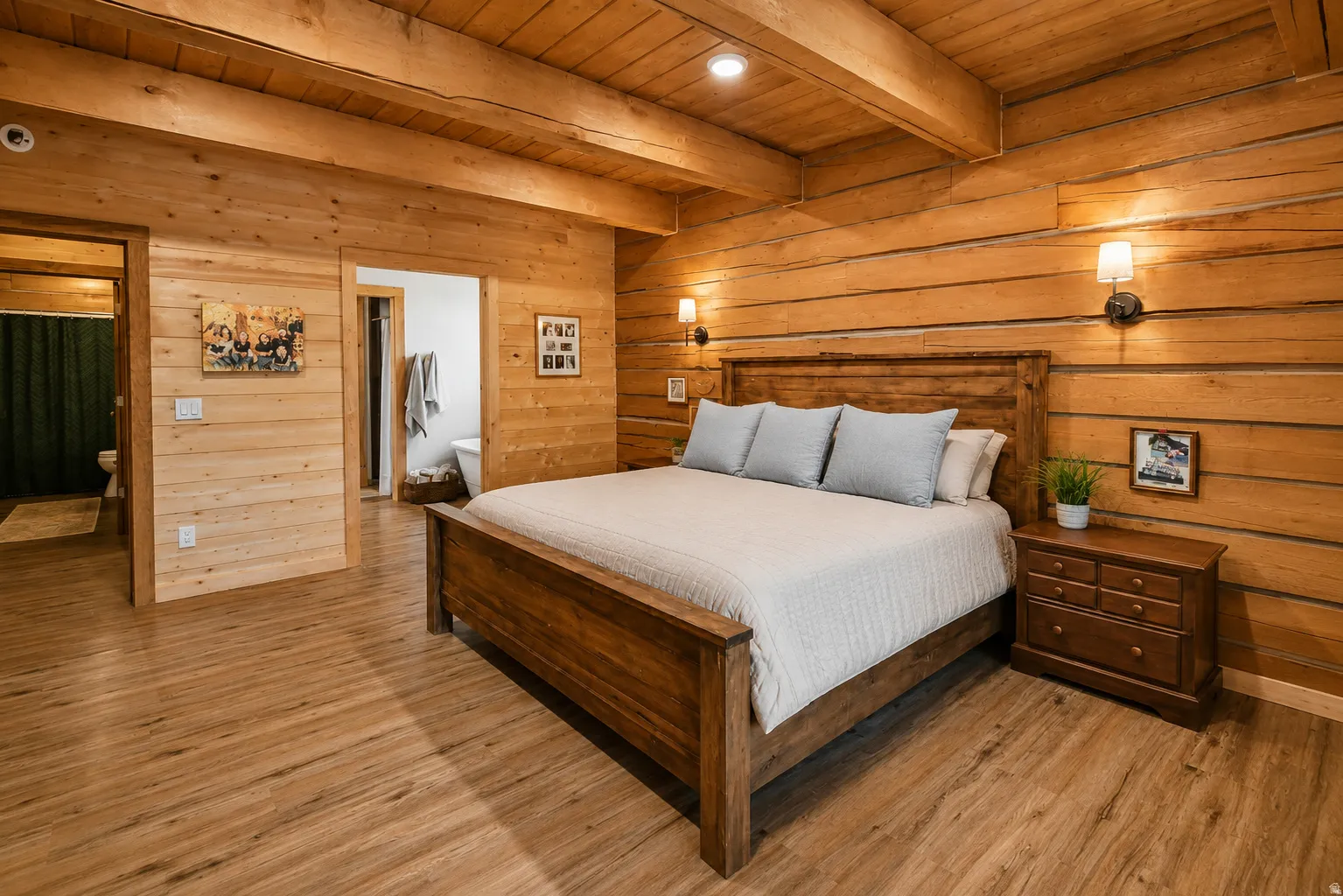 Wood-paneled room featuring a wood-finish flooring, exposed wood beams, and recessed ceiling lights