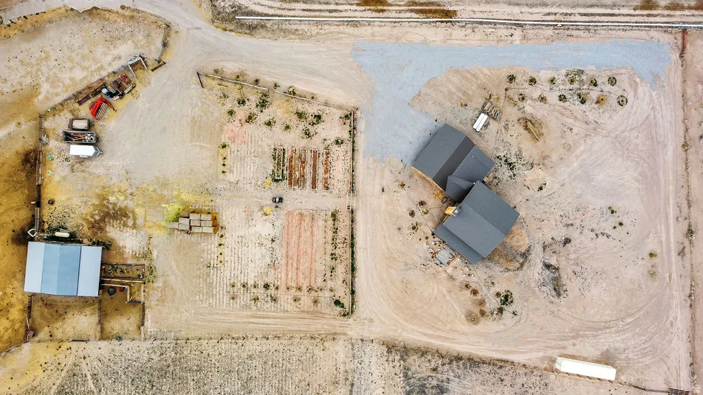 Expansive property featuring a multi-structure layout with a main residence and a separate large outbuilding