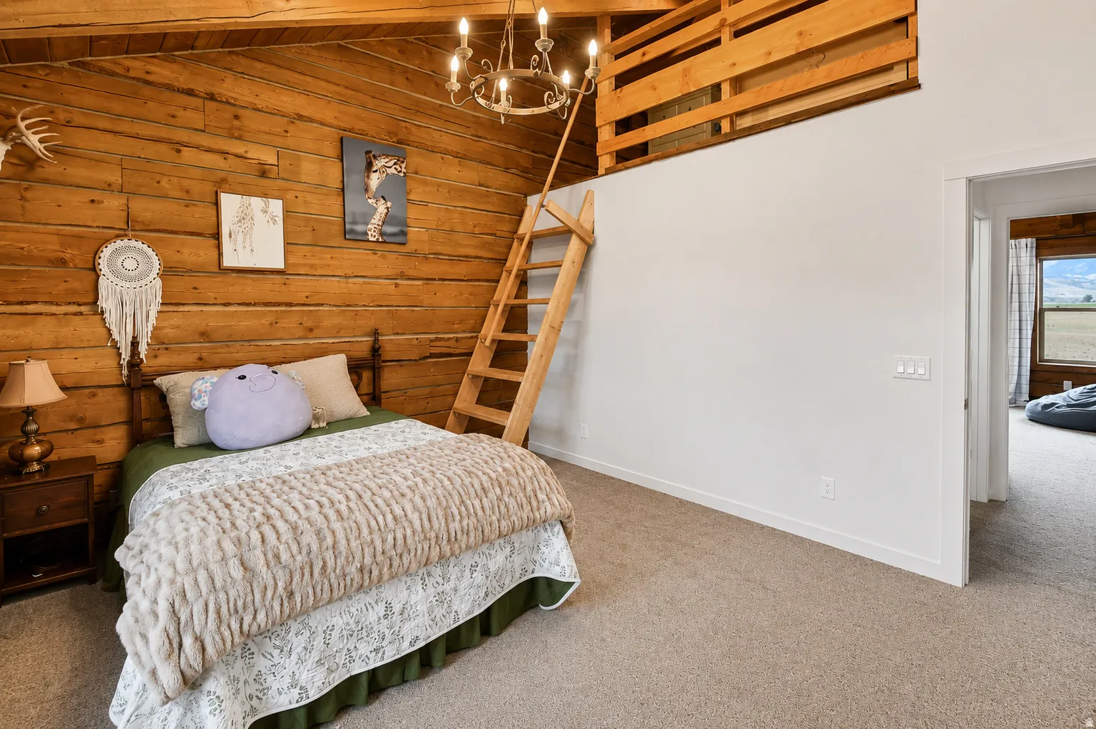 Interior room featuring wood-plank walls and a wood-beamed ceiling