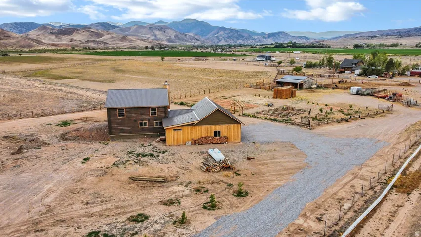 Rustic-style residence featuring a metal roof and wood siding