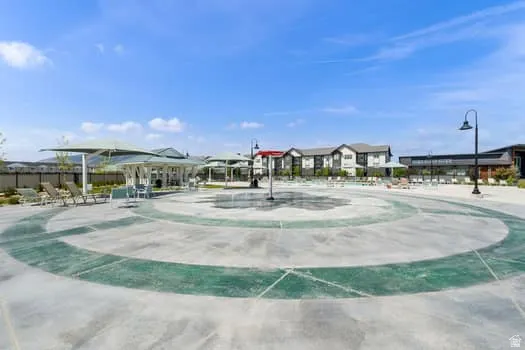 Community splash pad featuring a circular concrete design with green accents