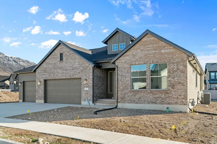 Contemporary residence featuring a brick and stucco exterior