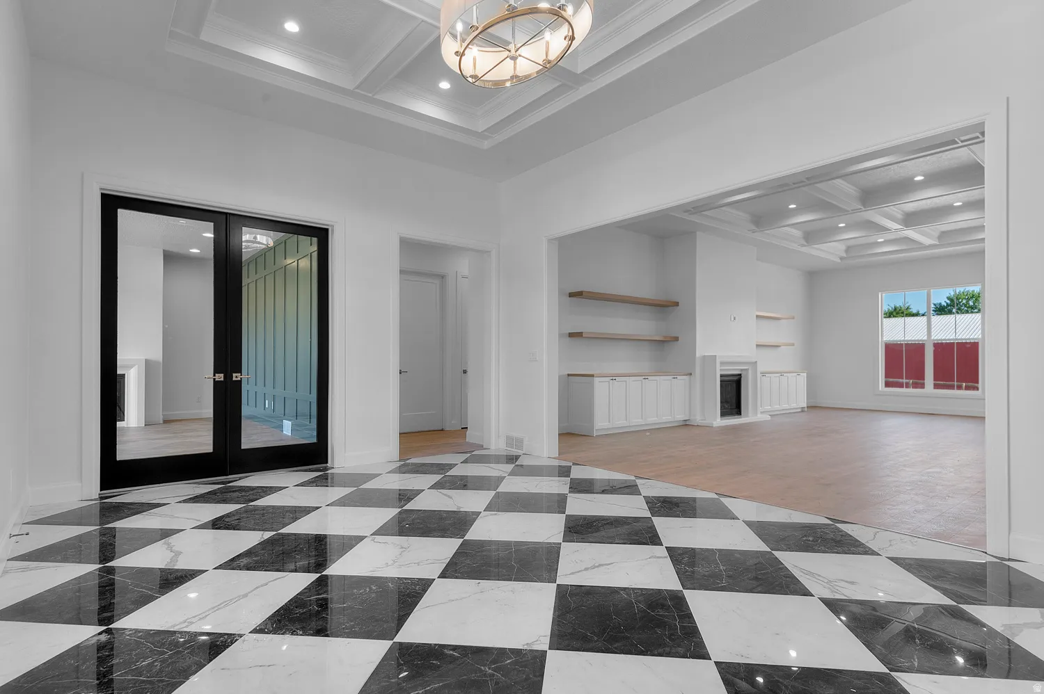 Entry foyer featuring black and white checkerboard tile flooring