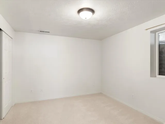 Neutral wall colors with light-toned carpeting
