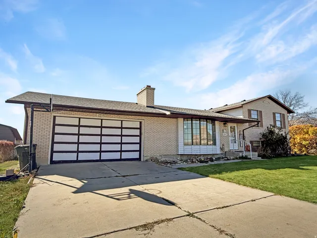 Brick exterior with a prominent modern garage door