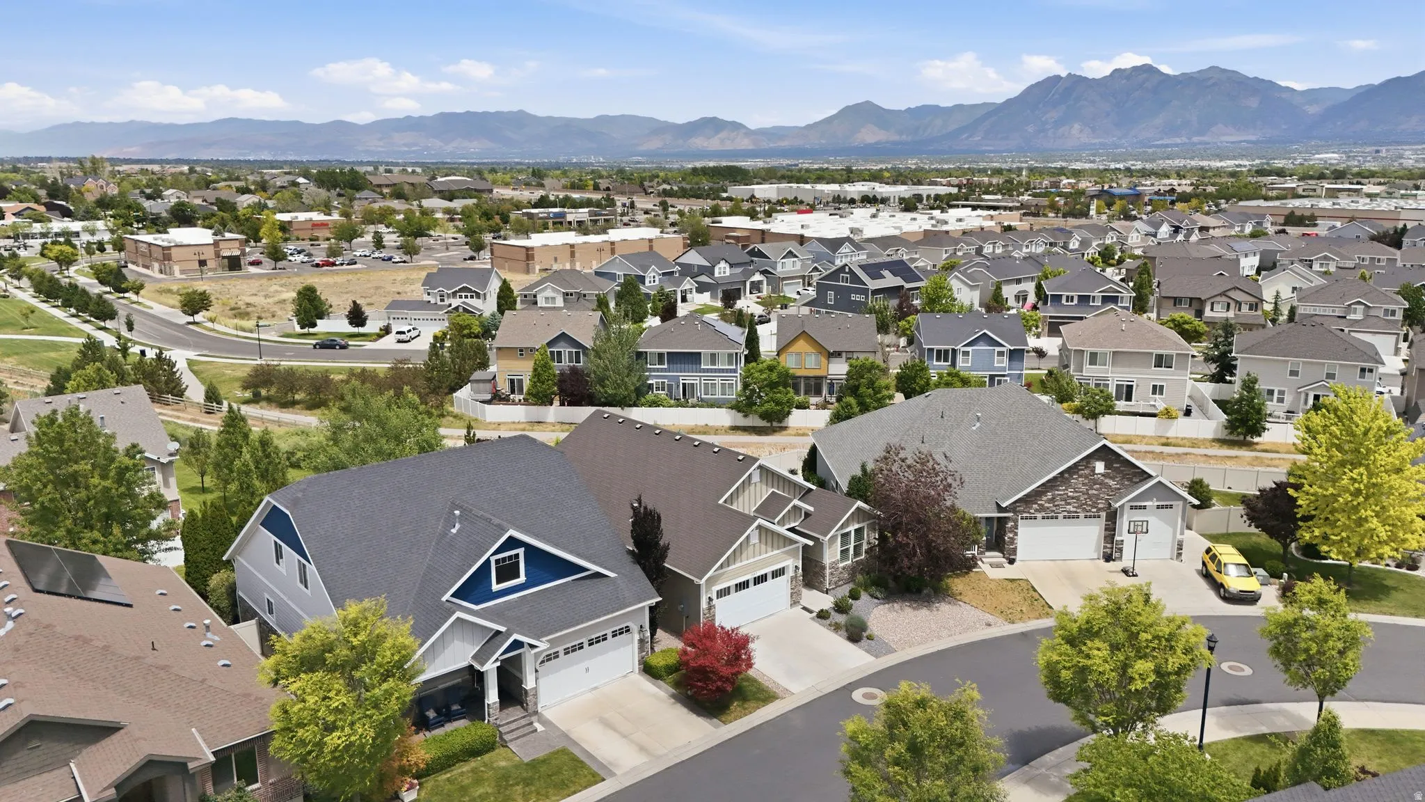 Residential neighborhood featuring varied architectural styles and mature landscaping