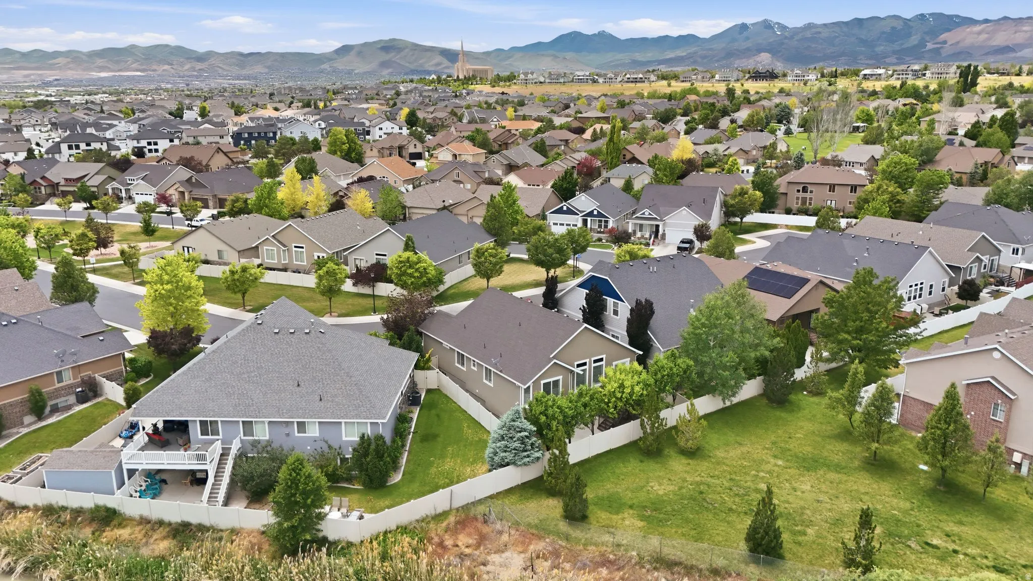 Expansive residential neighborhood featuring a variety of single-family homes with pitched roofs and mature landscaping
