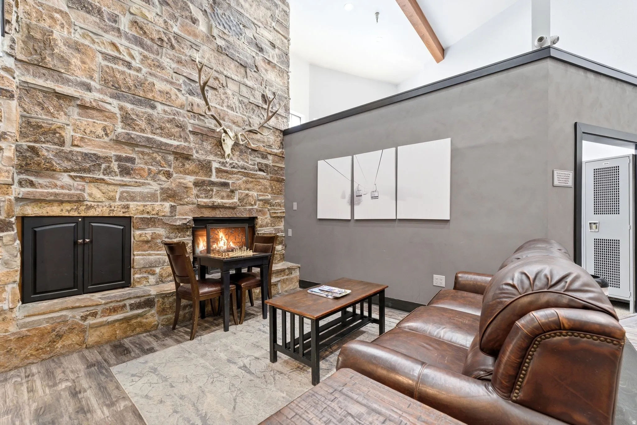 Stone-faced fireplace with a hearth and a secondary storage unit