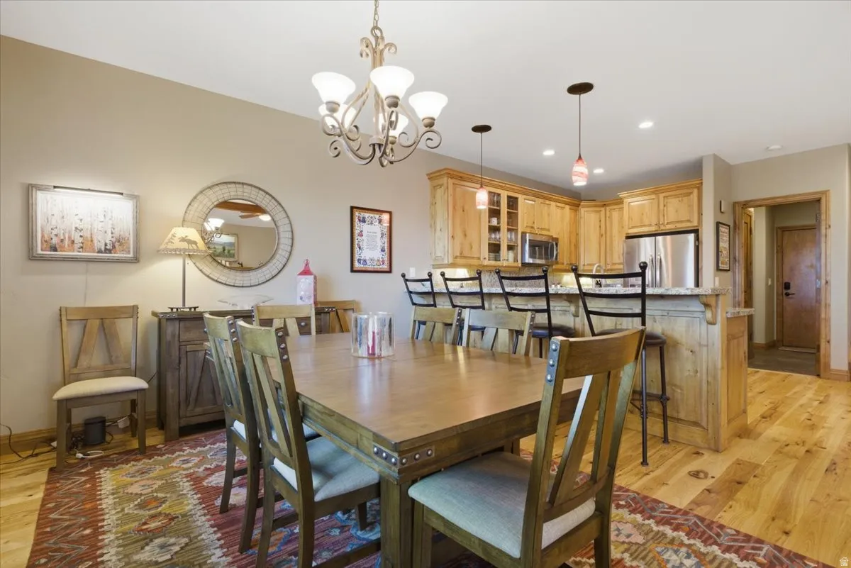 Open-concept living area featuring wood-finish flooring