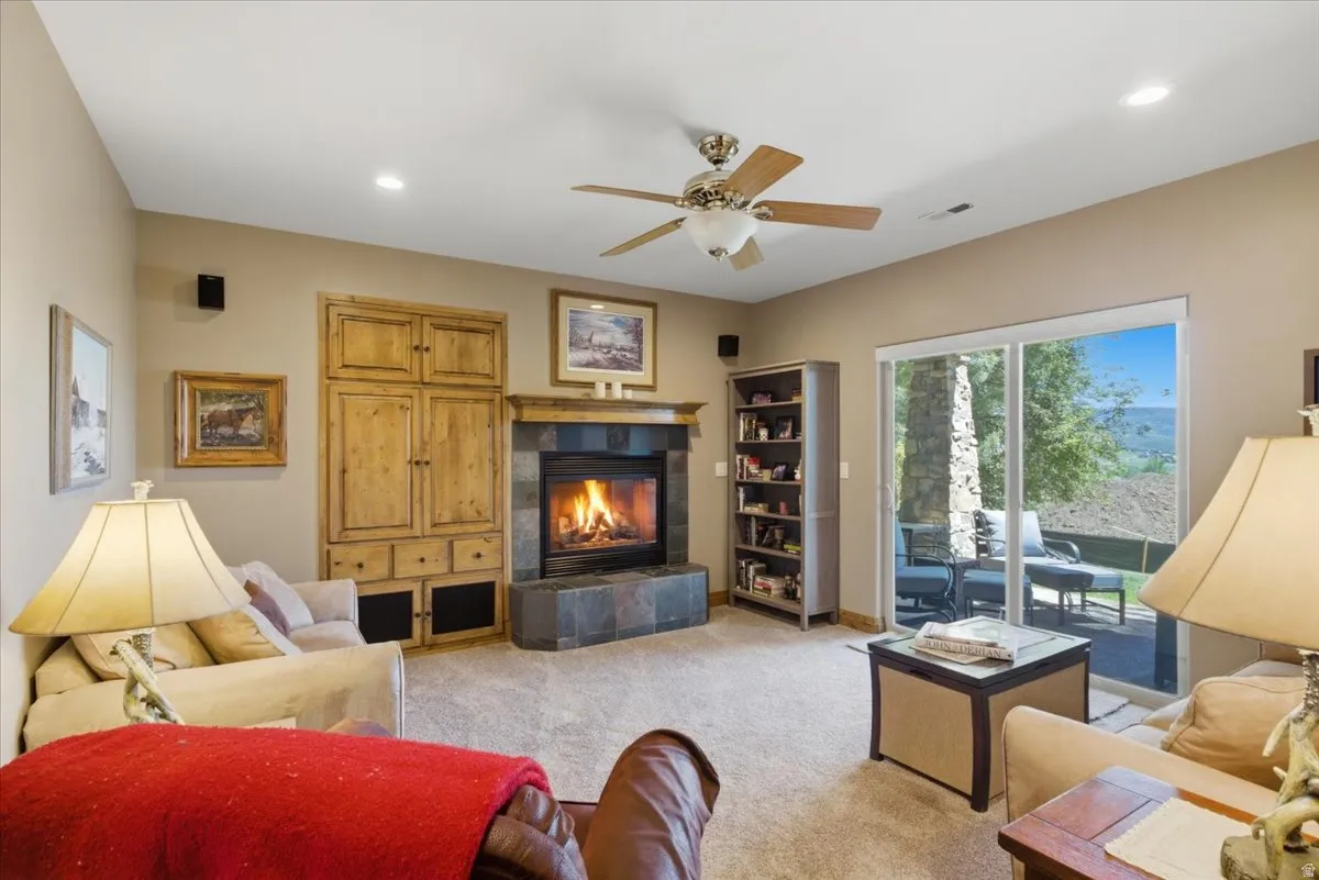 Basement living room featuring a fireplace