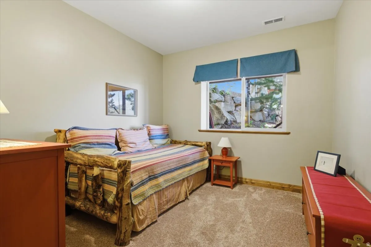 Bedroom featuring a double-pane window with lots of natural light
