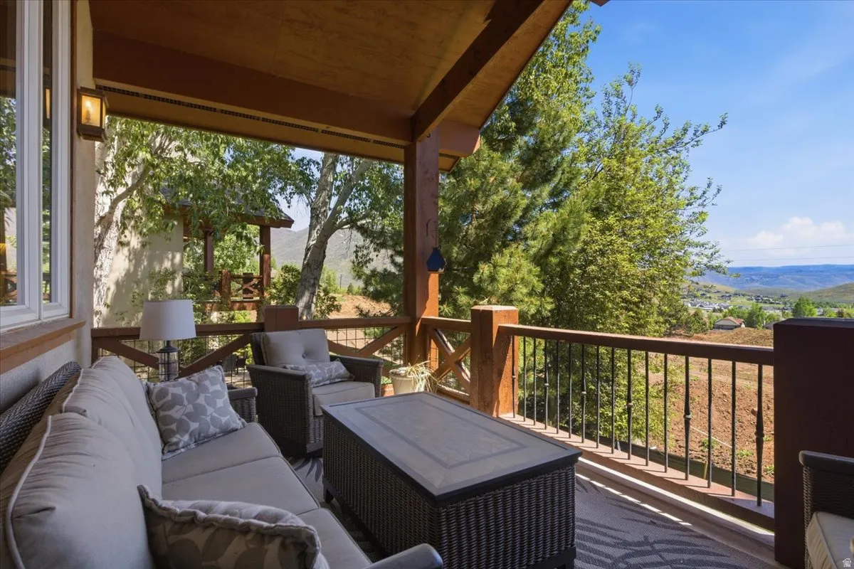 Covered outdoor deck featuring extensive wood beam construction