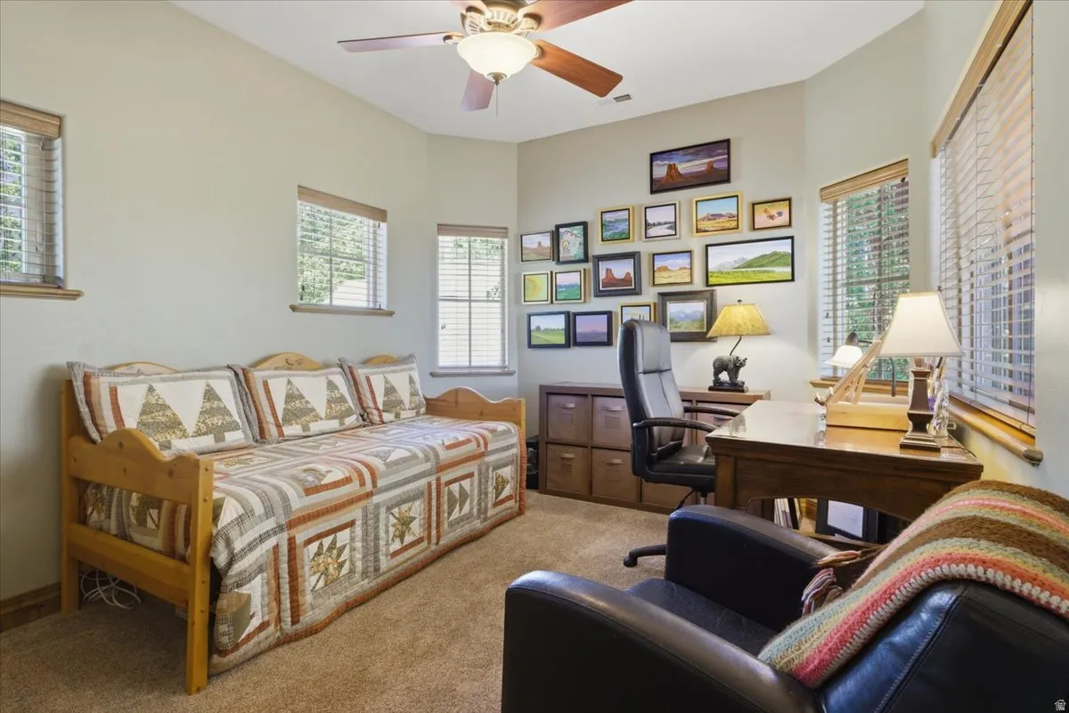 Office room featuring several windows