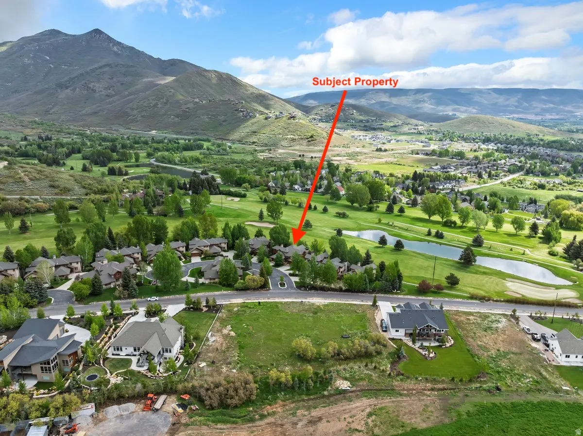 Aerial view of the landscape featuring a mountainous backdrop,