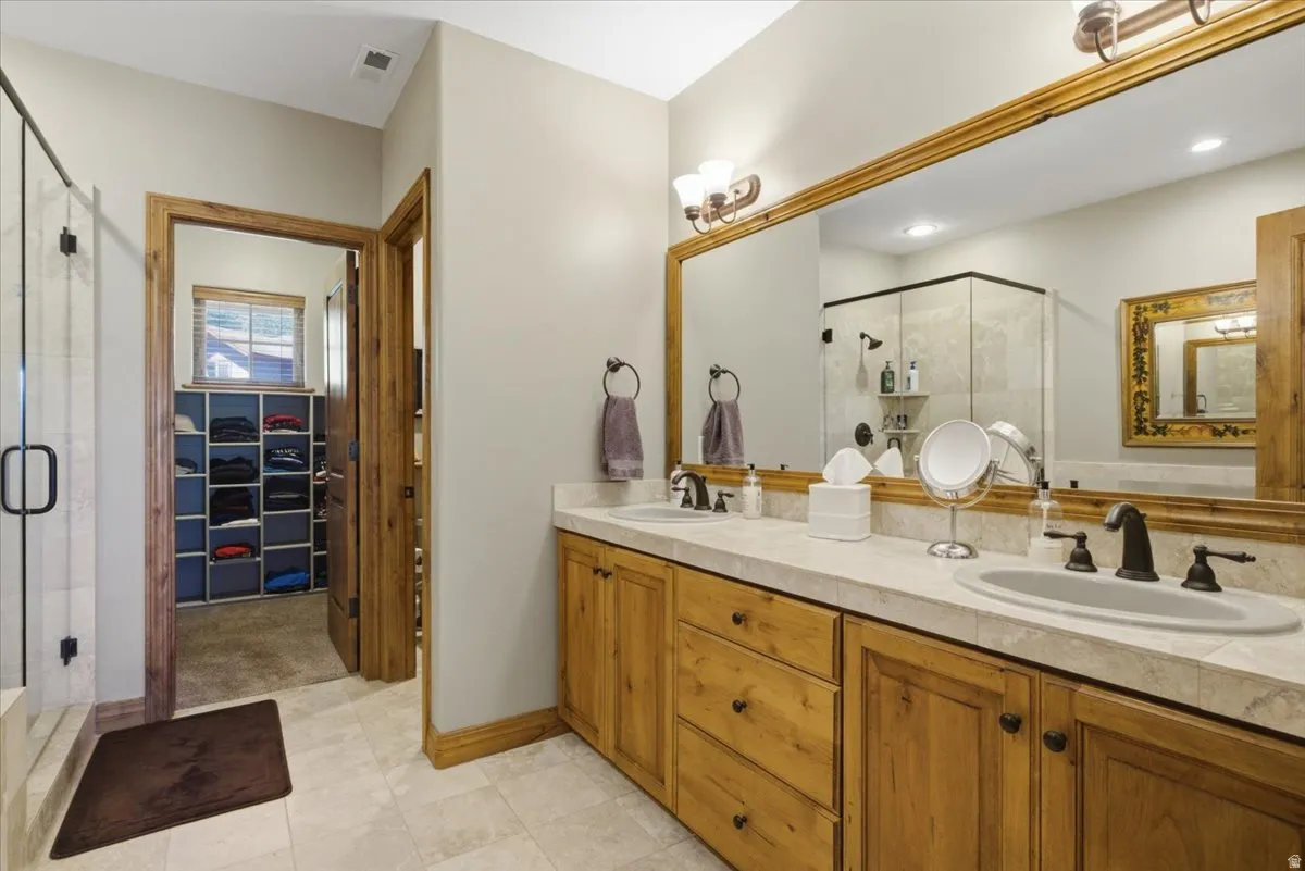 Master bathroom featuring a spacious closet