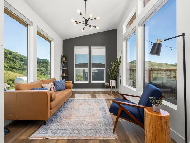 Vaulted ceiling great room with wood-finish flooring