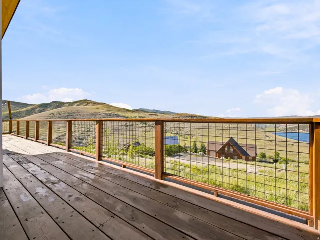 Expansive wood deck with metal grid railing