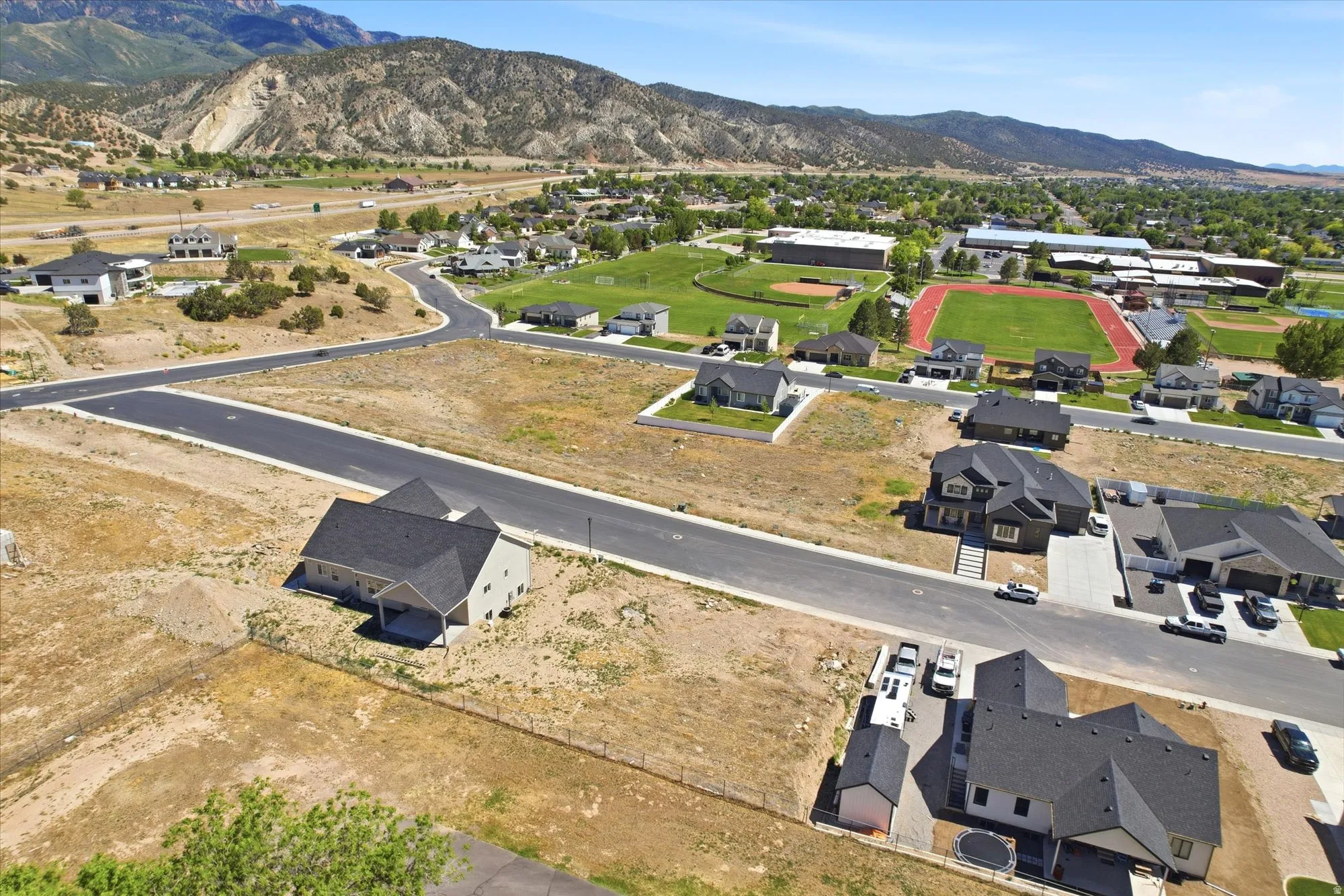 Newly constructed residential development featuring paved roads and several completed homes
