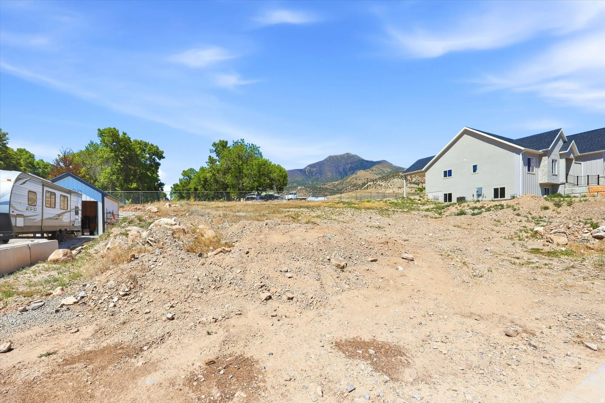 Expansive undeveloped lot featuring a mountainous backdrop