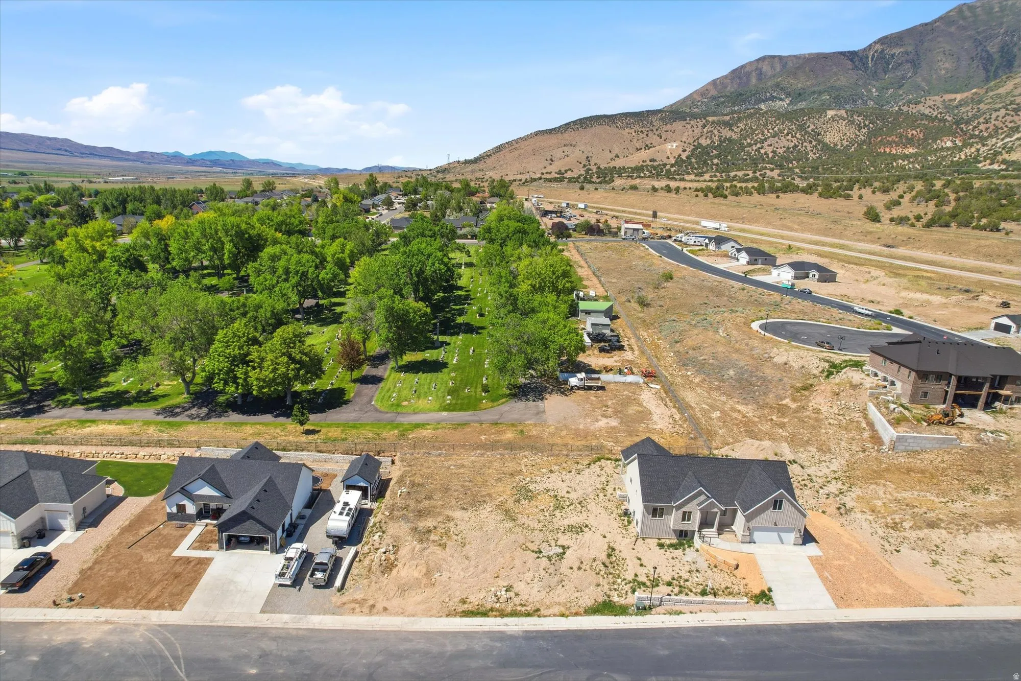 New construction home featuring a light-colored exterior, an attached two-car garage, and a concrete driveway