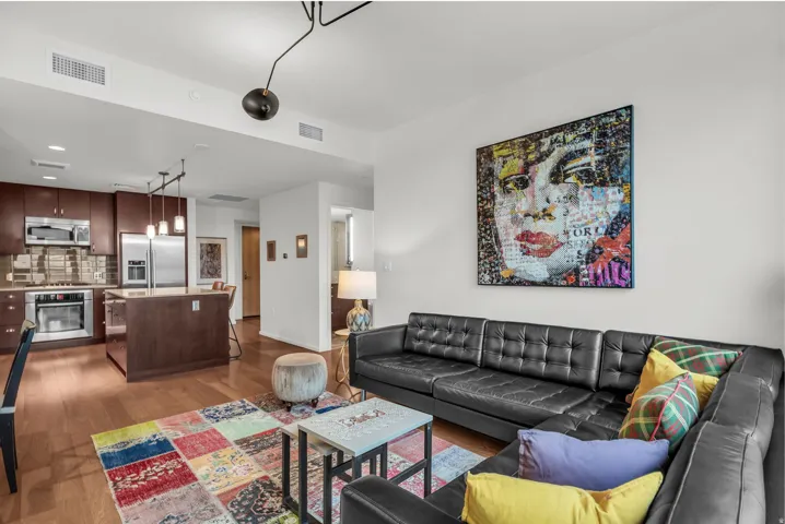 Open-concept living area with wood-finish flooring