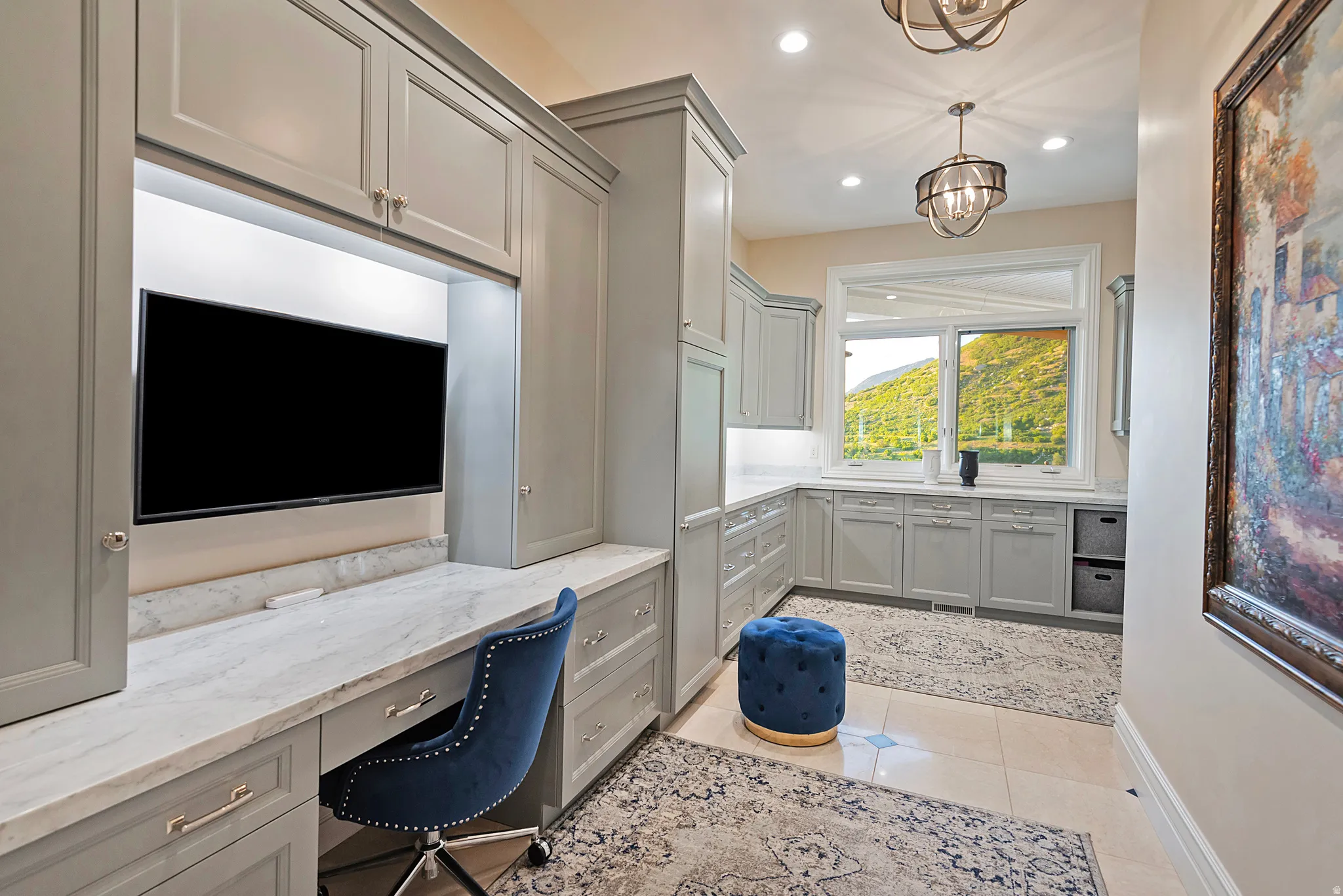 Built-in cabinetry in a neutral tone with a light-colored countertop