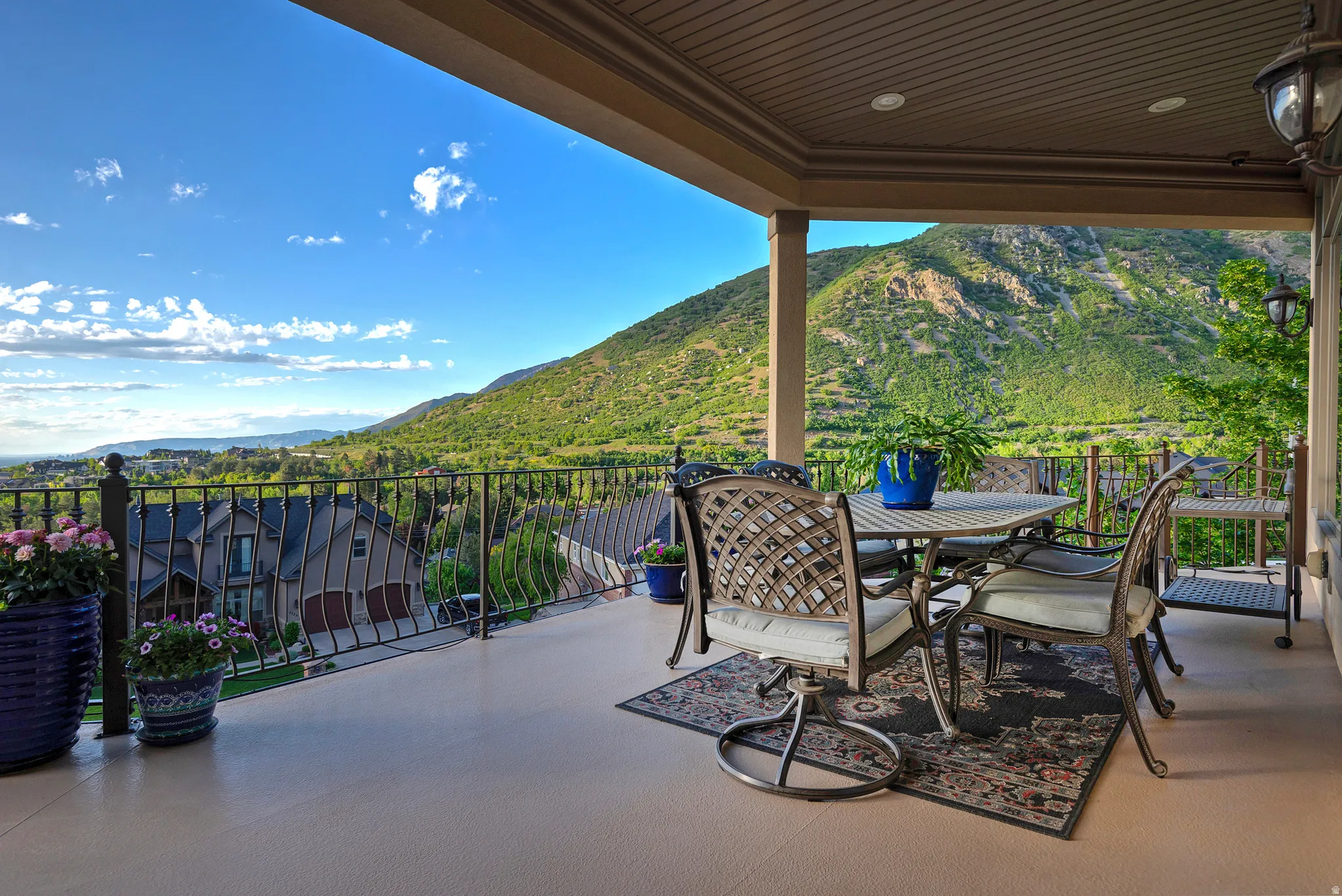 Covered patio with recessed lighting, offering expansive mountain and valley vistas