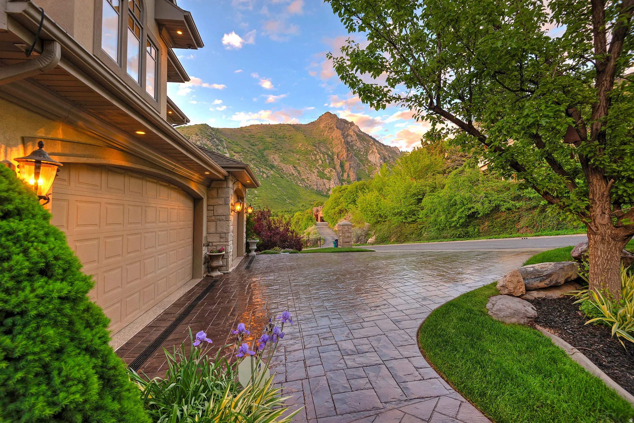 Stamped concrete driveway providing access to the two-car garage