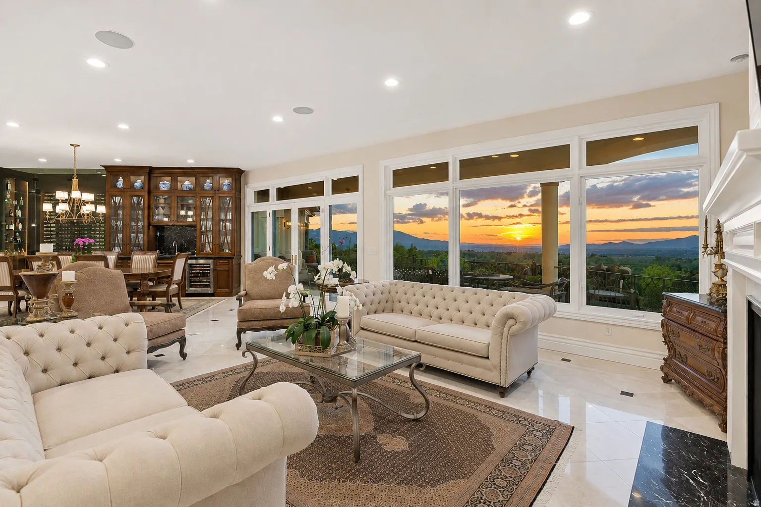 Expansive living area with large windows showcasing mountain scenery