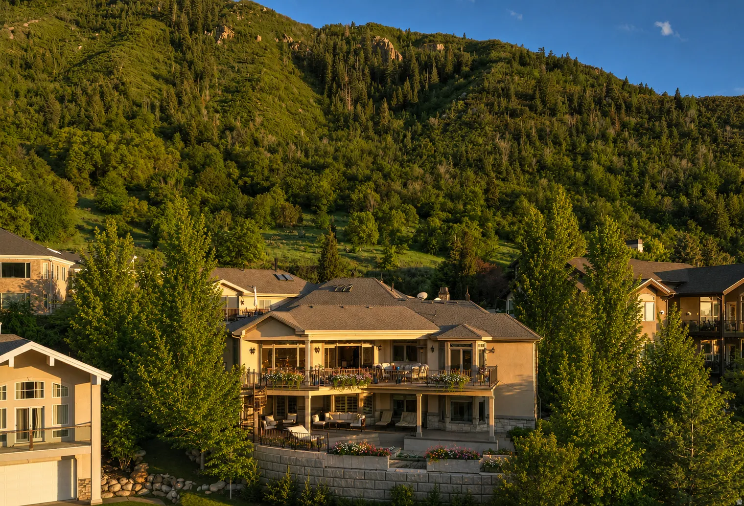 Multi-level residence featuring a prominent tiered facade and multiple balconies