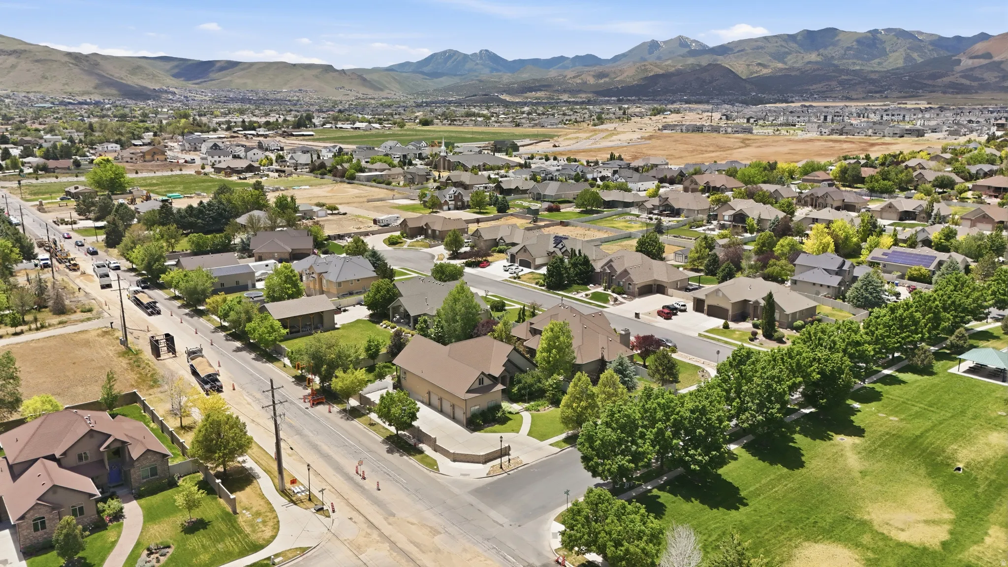 Residential neighborhood featuring single-story and two-story homes with pitched roofs