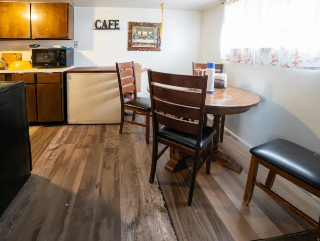 Kitchen area featuring wood-finish flooring