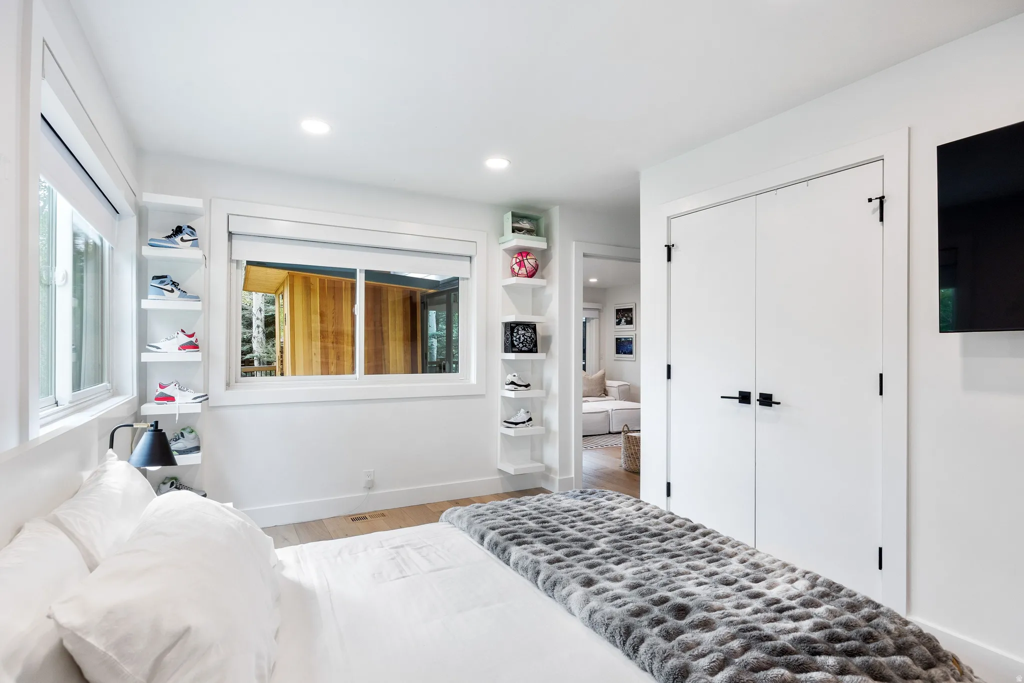 Bedroom featuring light wood-finish flooring, recessed lighting, and white walls