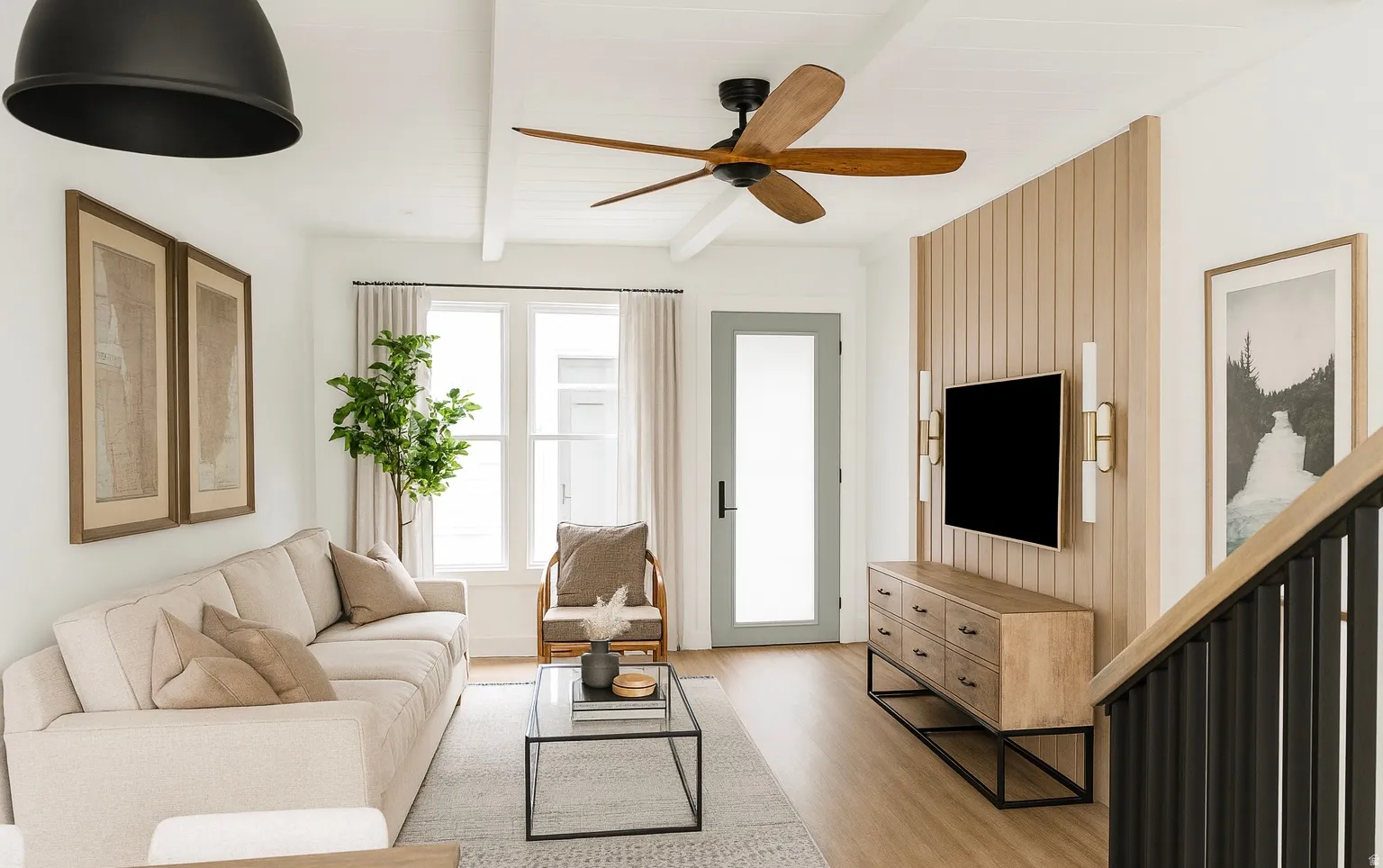 Living area featuring light wood-finish flooring, a contemporary ceiling fan, and a light-toned wood slat accent wall with integrated sconces