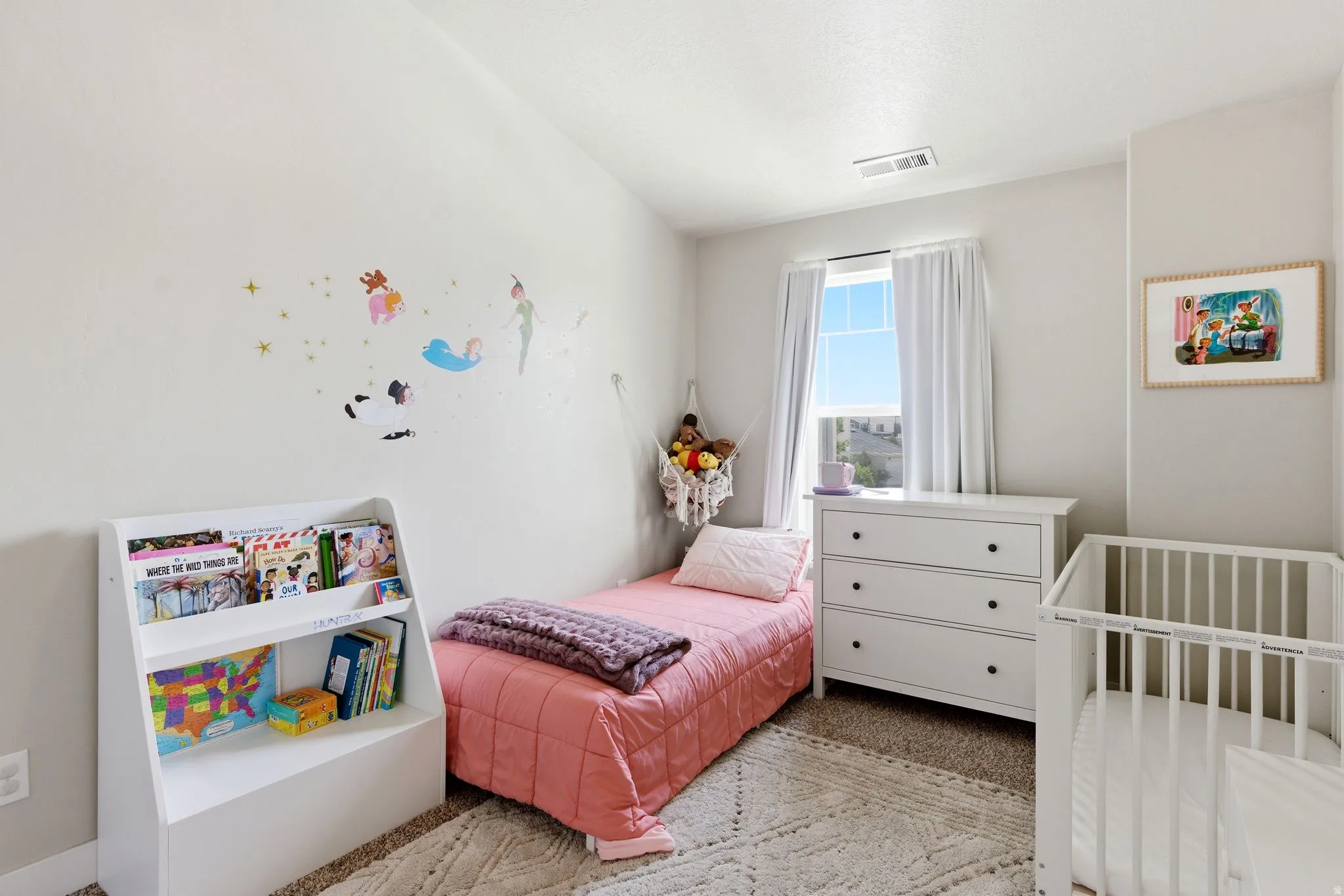 Room featuring light-colored walls and carpet flooring