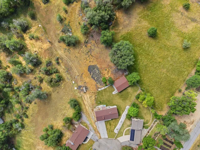 Aerial perspective showcasing multiple properties and expansive natural landscaping