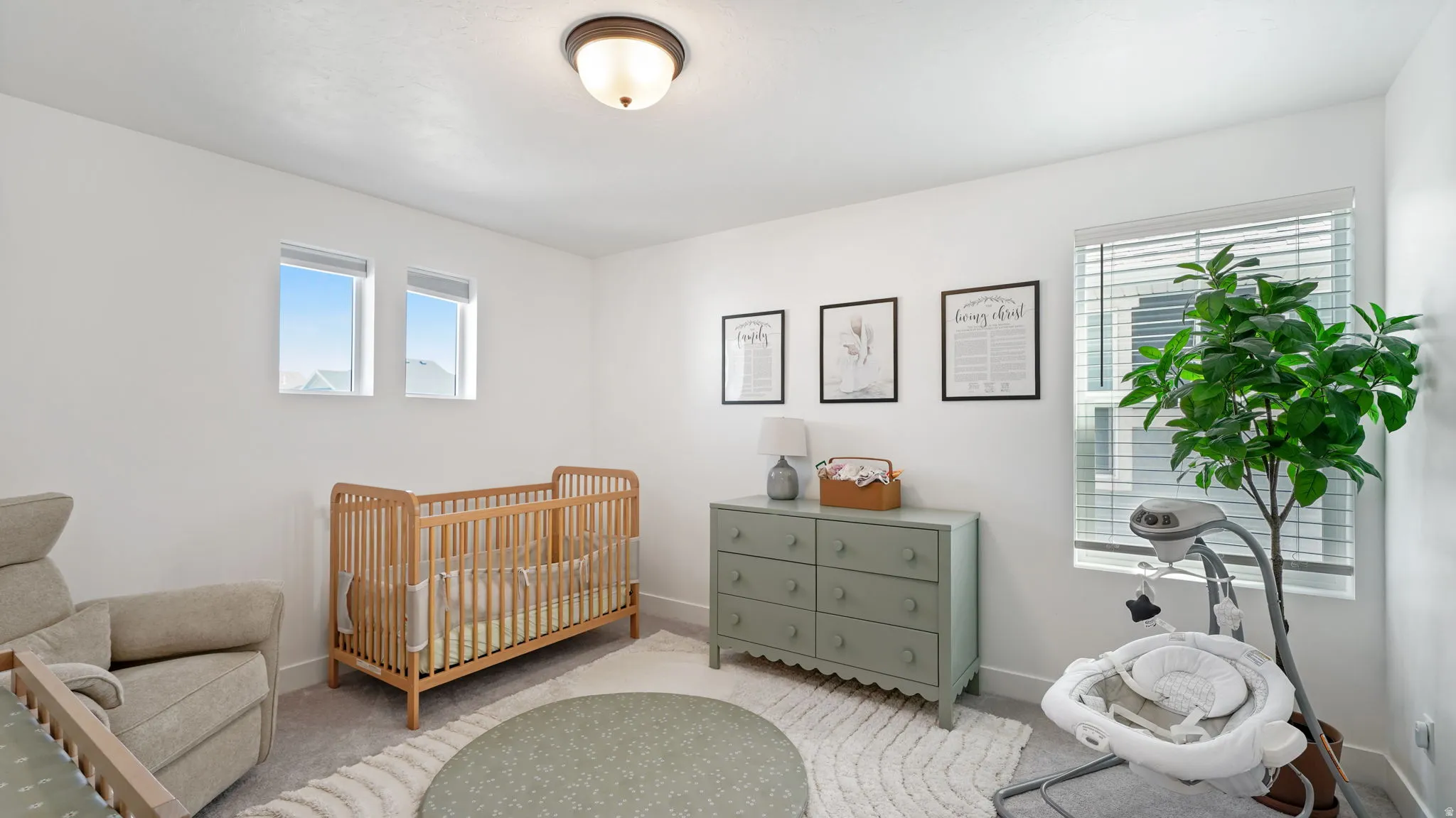 White walls with recessed window frames and an overhead flush-mount light fixture