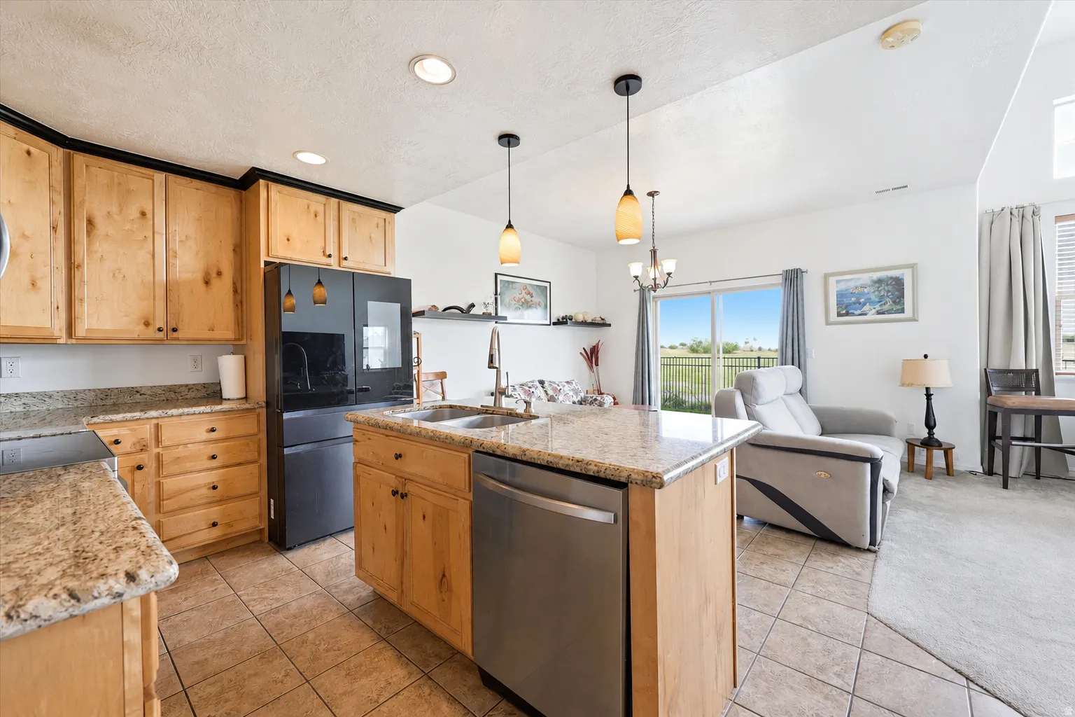Gorgeous views and natural lighting from every direction. Entertain friends and family inside and out on covered patio.