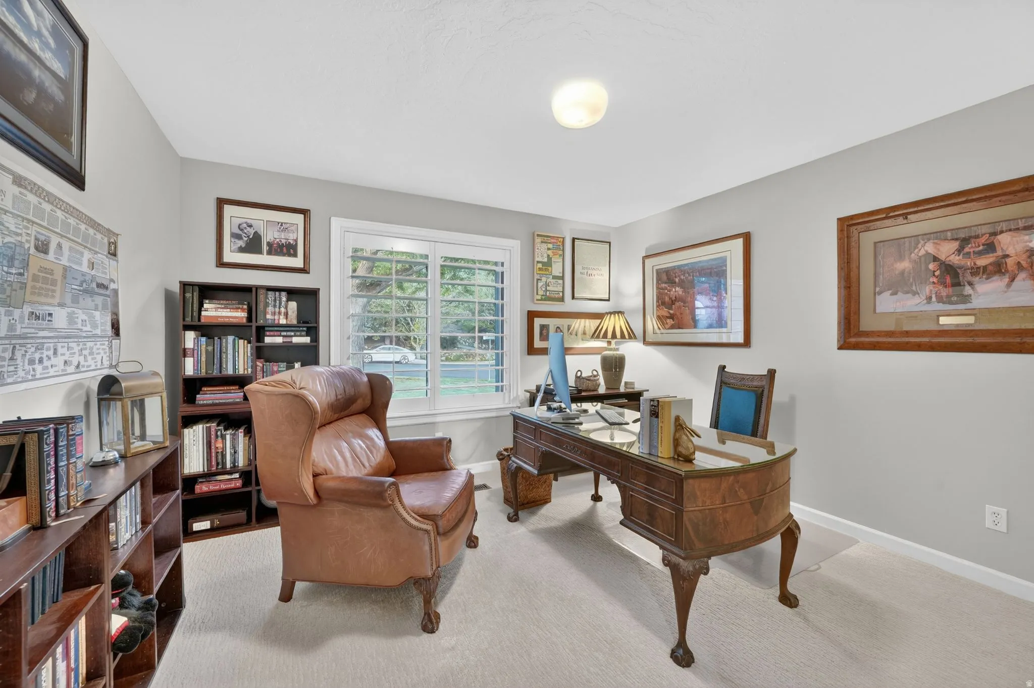 Bright interior space featuring light-toned carpeting and neutral wall colors