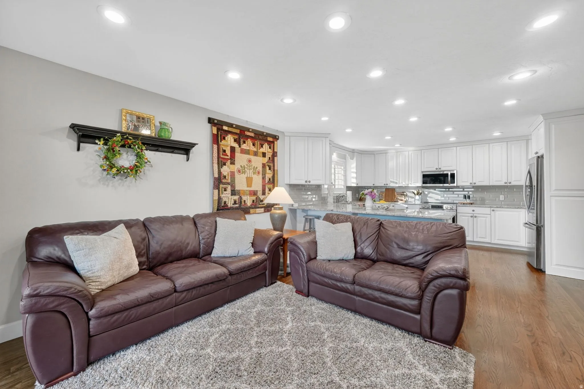 Open-concept living area with recessed lighting
