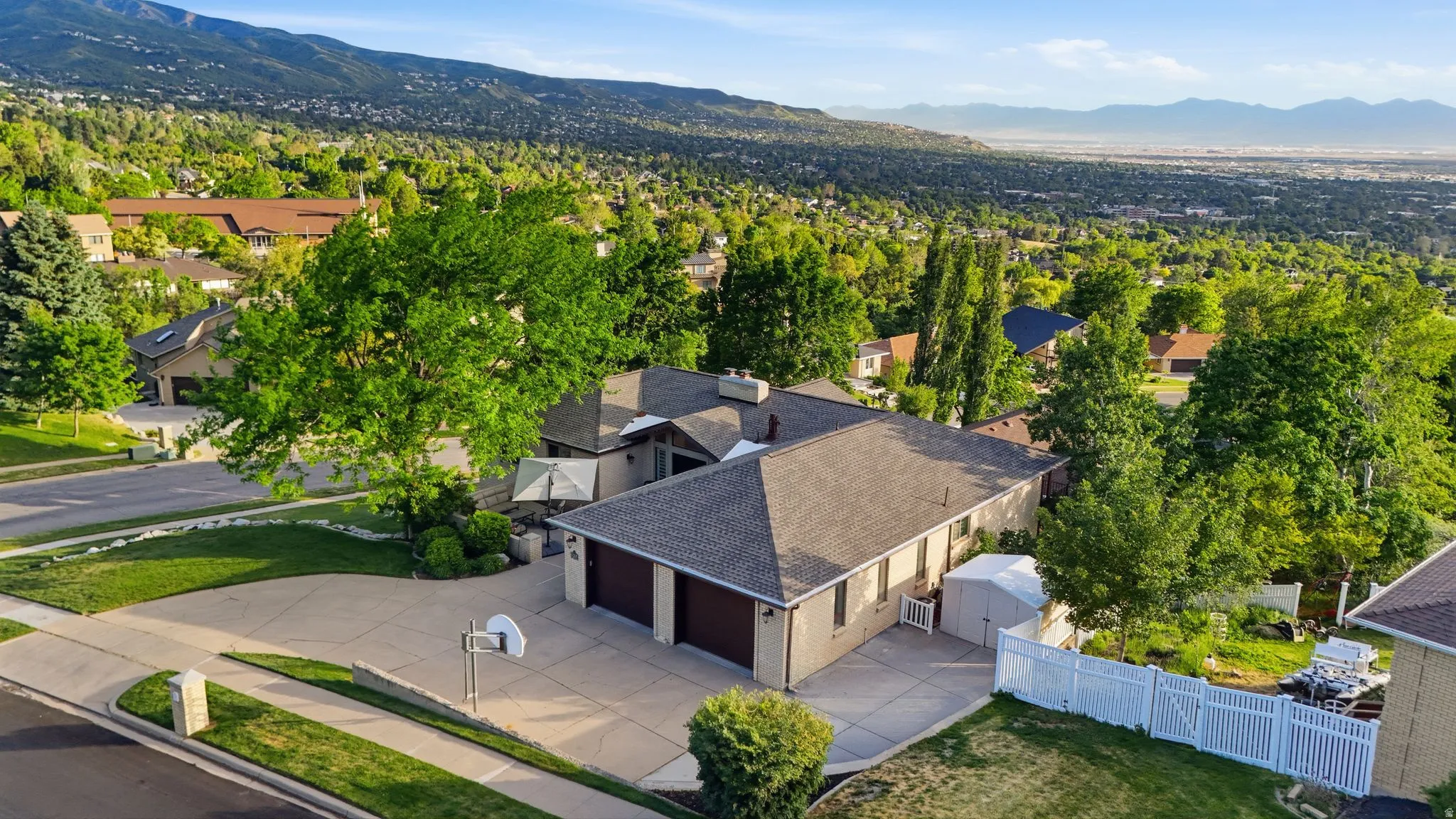 Expansive residential property with a multi-level design and a large driveway