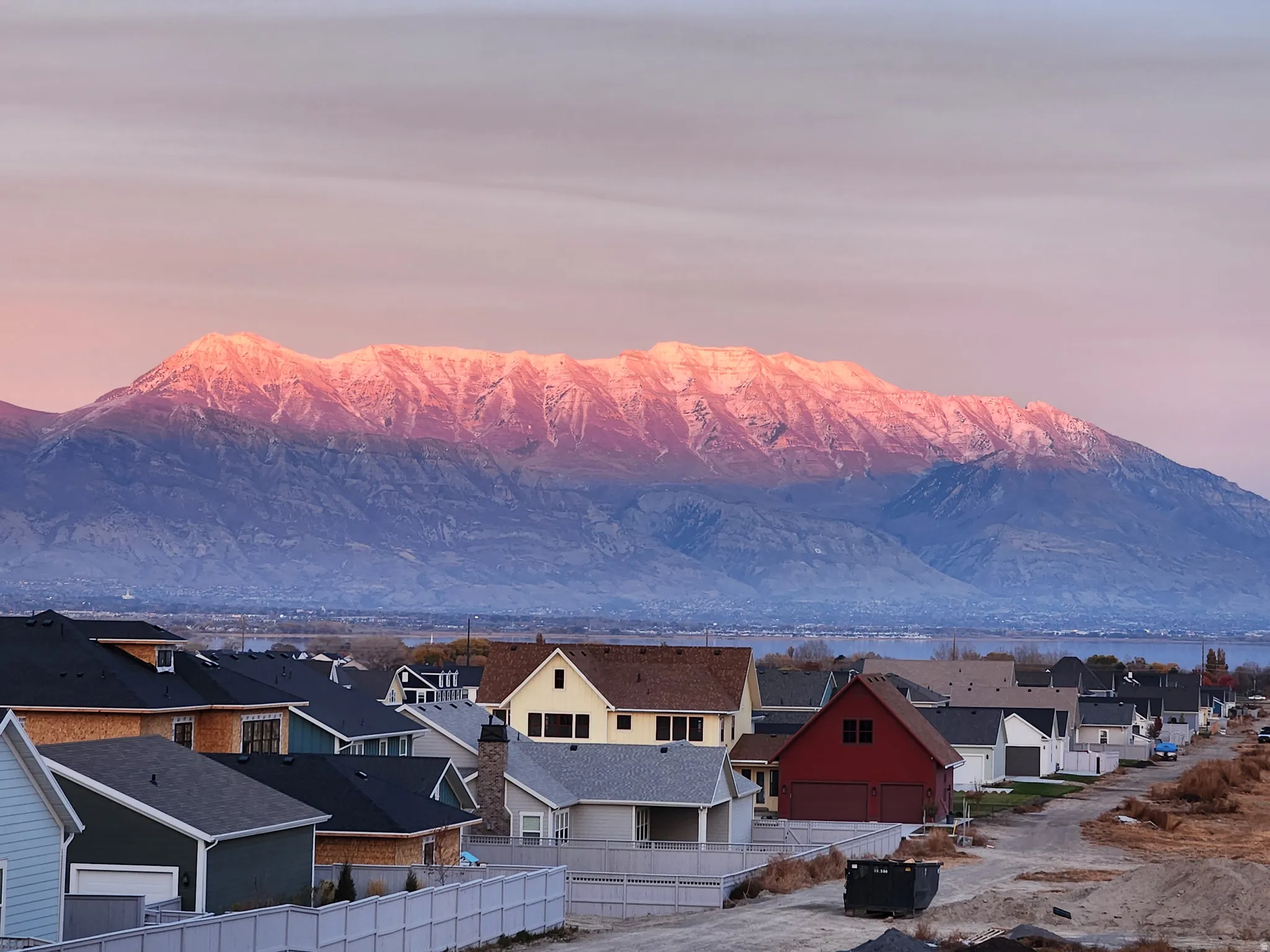 Mountain range in the background with a partial residential development in the foreground