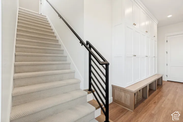 Access to the private guest loft suite is through through the back hallway.