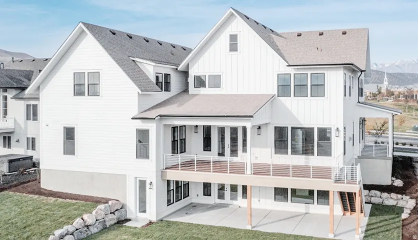 Contemporary white board-and-batten exterior with a multi-level design