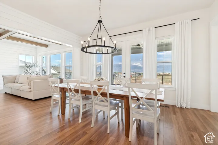 This generously sized dining area boasts gorgeous mountain views and features French doors that open to a spacious covered deck.